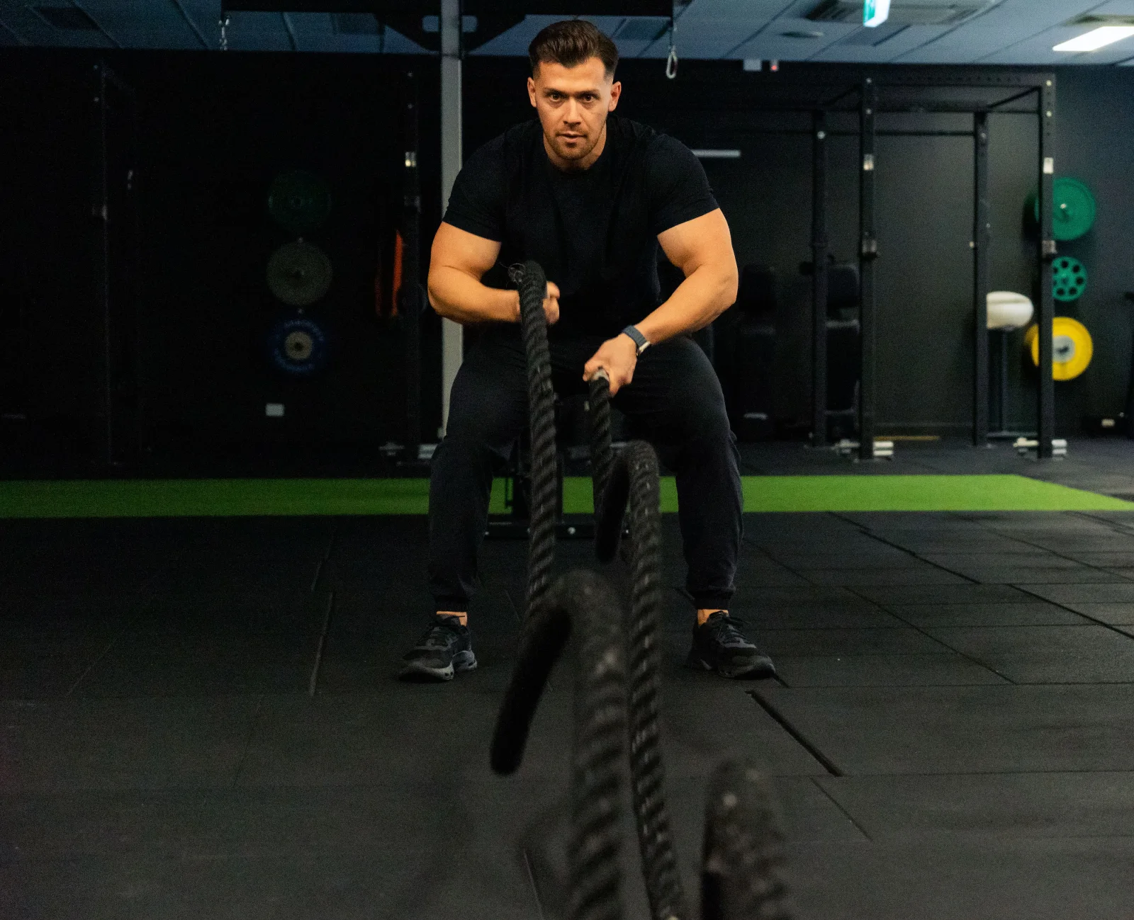 Hudson demonstrating battle rope training